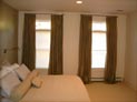 Silhouette shades and drapes for bedroom windows in Manhattan, NY