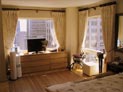 Drapes on decorative hardware for bedroom windows in 5th Avenue apartment, Manhattan