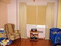 Blackout honeycomb shades and side panels for baby�s room in lower Manhattan