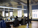 Room darkening roller shades for large windows in lower Manhattan office