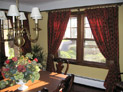 Drapes on decorative hardware for dining room windows in Long island, New York