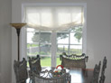 Relaxed roman shade in dining room windows in Hamptons, NY