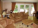 Pinch pleated curtains on decorative hardware for living room windows in Connecticut 