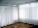 Sheer drapes for floor to ceiling windows in down town Brooklyn apartment, New York