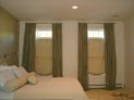 Relaxed roman shades and silk drapes for master bedroom in Manhattan, NY