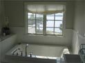 Relaxed roman shade for master bathroom window in Hampton, NY