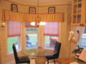Honeycomb shades and box-pleated valance for eat-in kitchen in a Westchester home