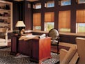 Pleated shades in home office windows