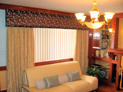Straight cornice with drapes and vertical blinds in Brooklyn, New York