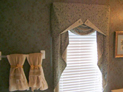 Valance with jabot and wood blinds for bathroom window in NYC