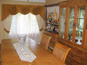 Swags and drapes along with sheers for dining room window in Long Island, NY