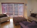 Fabric vertical blinds in living room large sliding doors in NYC