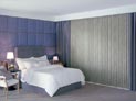 Vertical blinds with side panels in bedroom