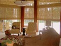 Woven wood shades and side panels for living room