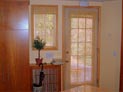 Woven wood shades for a window and door 