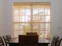 Woven wood shade for dining room window